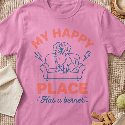 Pink t-shirt with dog on couch graphic and text "My Happy Place Has a berner."