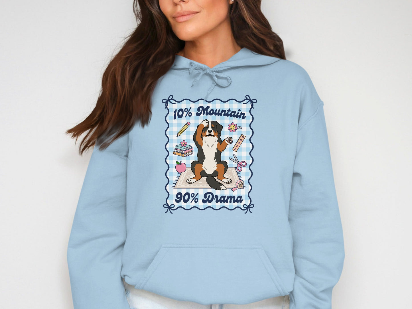 Light blue hoodie with a Bernese Mountain Dog graphic saying "10% Mountain, 90% Drama".