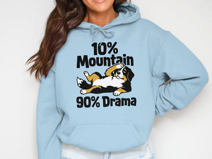 Light blue hoodie with "10% Mountain 90% Drama" text and a Bernese mountain dog graphic.