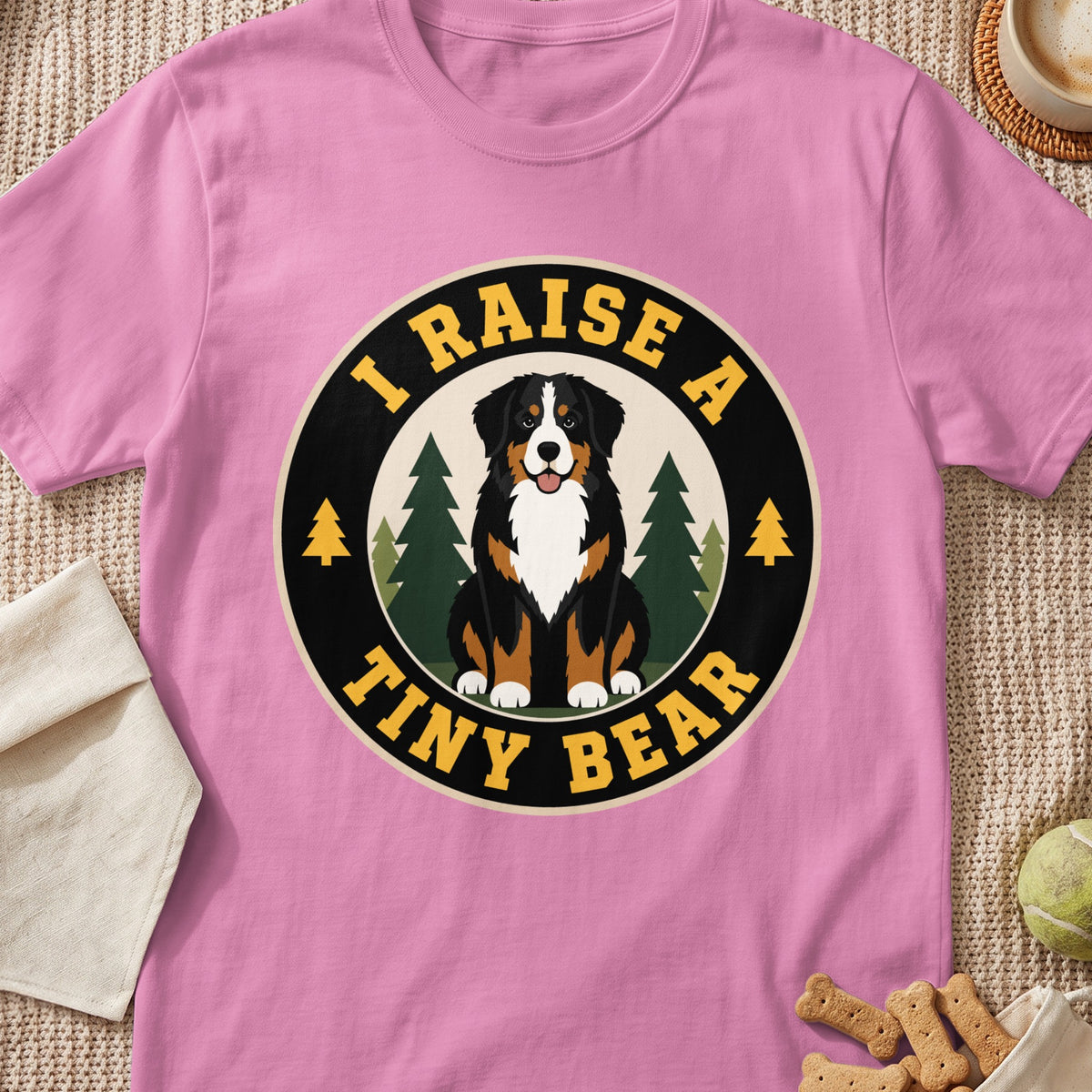 Bernese Mountain Dog graphic with text "I RAISE A TINY BEAR" on a pink shirt.