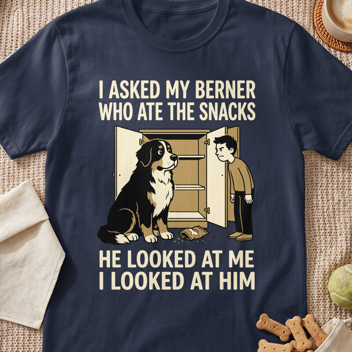 Bernese Mountain Dog next to open cabinet, boy looking at dog, snack bag on floor.