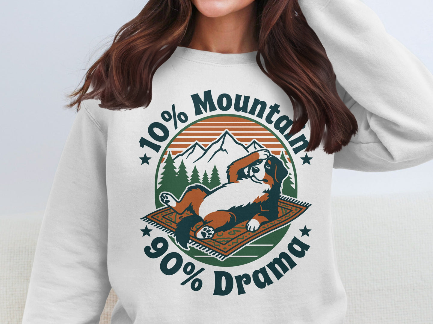Bernese Mountain Dog lying on a rug with text "10% Mountain 90% Drama".