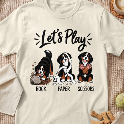 Bernese Mountain Dogs play rock, paper, scissors with "Let's Play" text.
