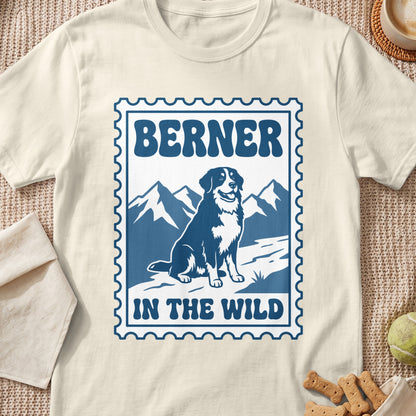 Berner dog and mountains graphic with text "BERNER IN THE WILD" within a stamp outline.