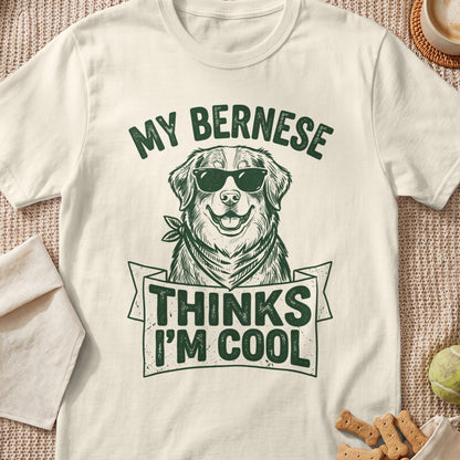 Cream t-shirt with a green graphic of a Bernese Mountain Dog wearing sunglasses and bandana.