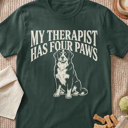 Dark green t-shirt with distressed graphic of a dog and text "MY THERAPIST HAS FOUR PAWS".