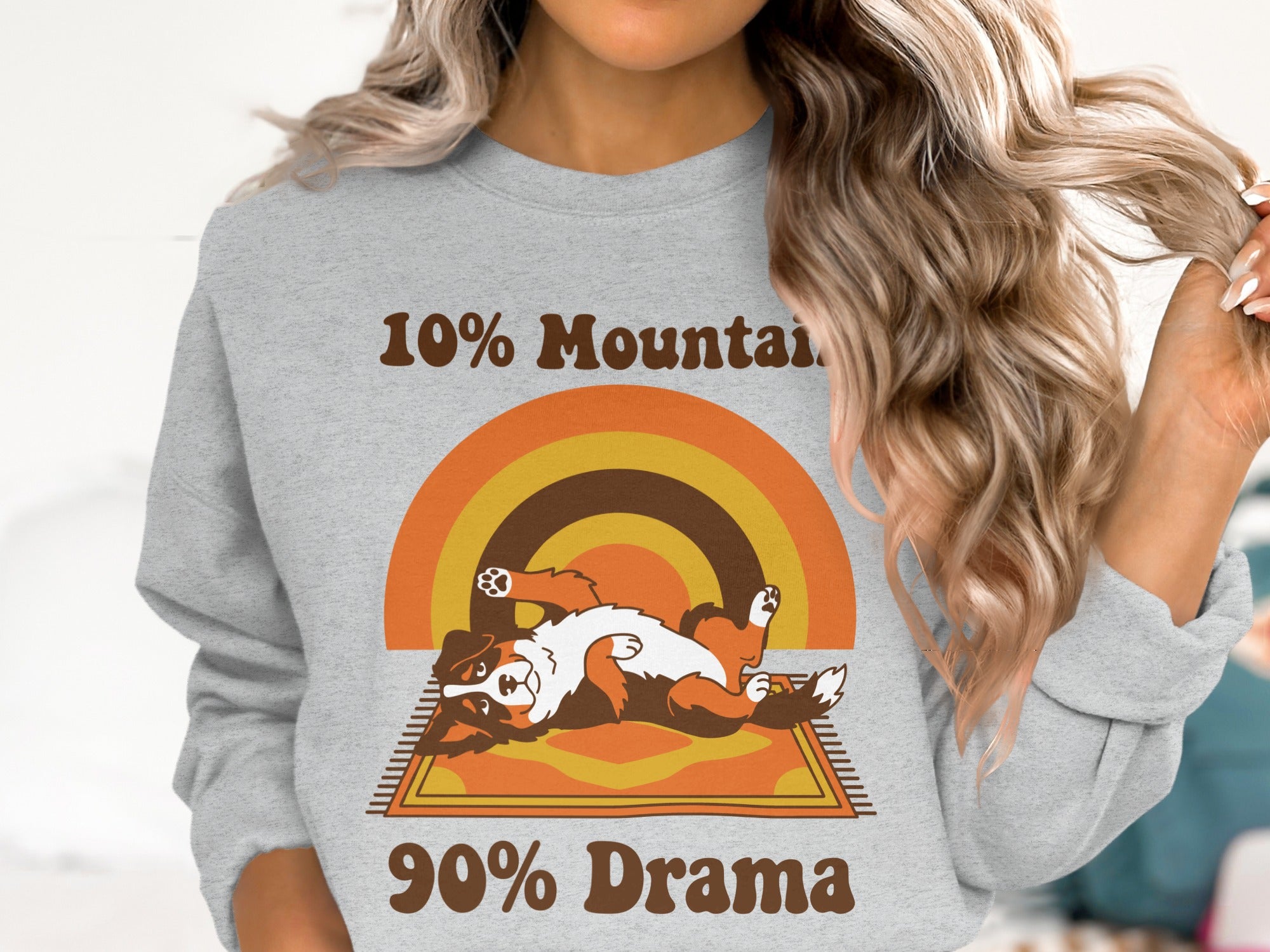 Bernese Mountain Dog on a rug with text: 10% Mountain, 90% Drama.