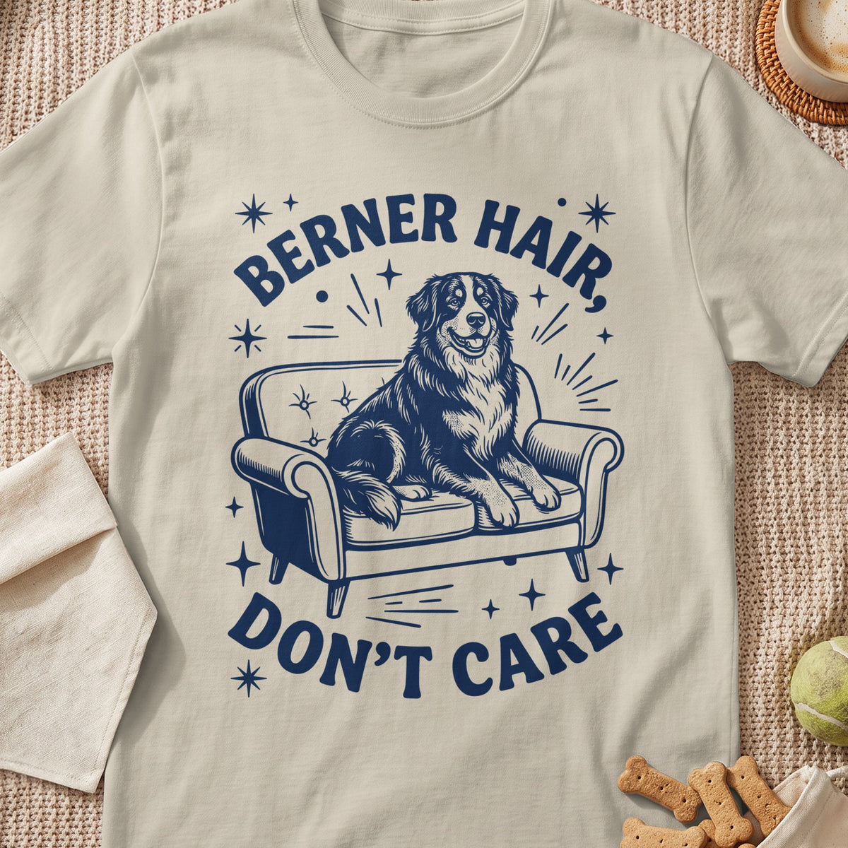 Berner hair don't care graphic on a light t-shirt with a dog on a couch.