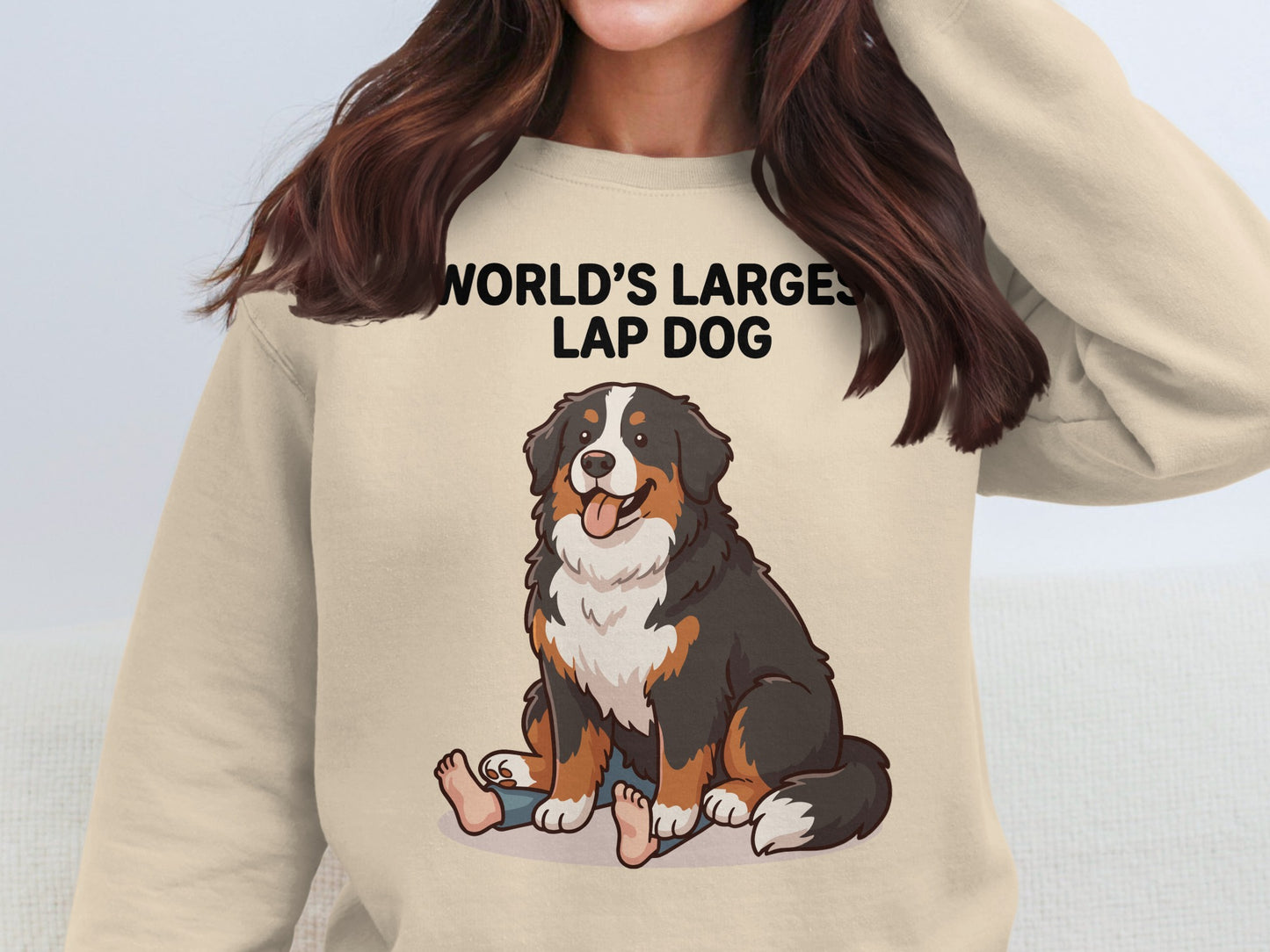 Bernese Mountain Dog sitting on lap with text "WORLD'S LARGEST LAP DOG".