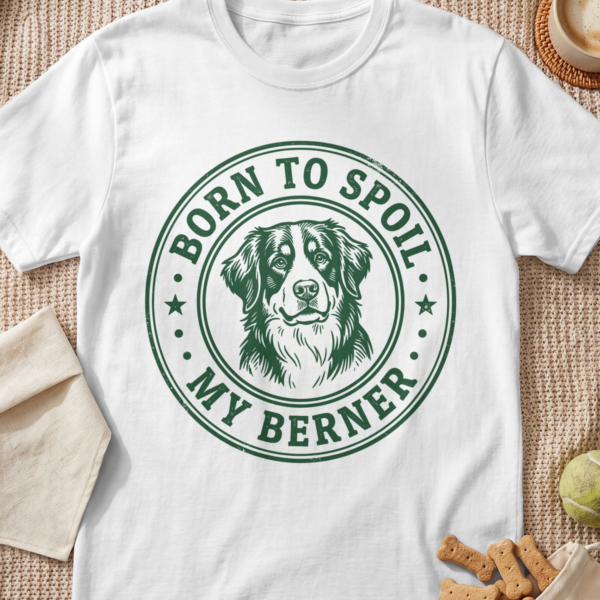 White t-shirt with green circular graphic featuring a Bernese Mountain Dog and text "BORN TO SPOIL MY BERNER".