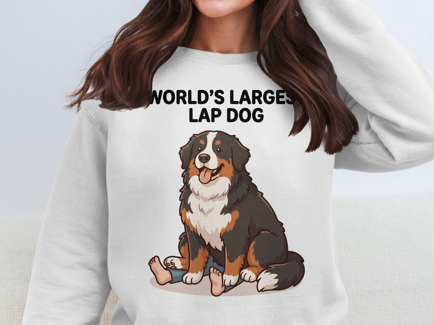 White sweatshirt with "WORLD'S LARGEST LAP DOG" and cartoon Bernese Mountain Dog.