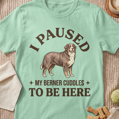 Light green t-shirt with a drawing of a Berner dog and text "I PAUSED MY BERNER CUDDLES TO BE HERE".