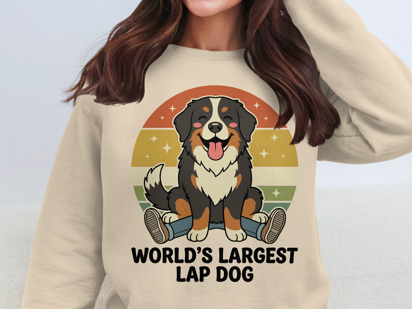 Bernese Mountain Dog graphic with "WORLD'S LARGEST LAP DOG" text on a cream sweatshirt.