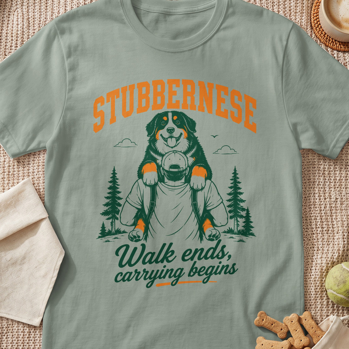 Green t-shirt with "STUBBERNESE" and dog carrying text.