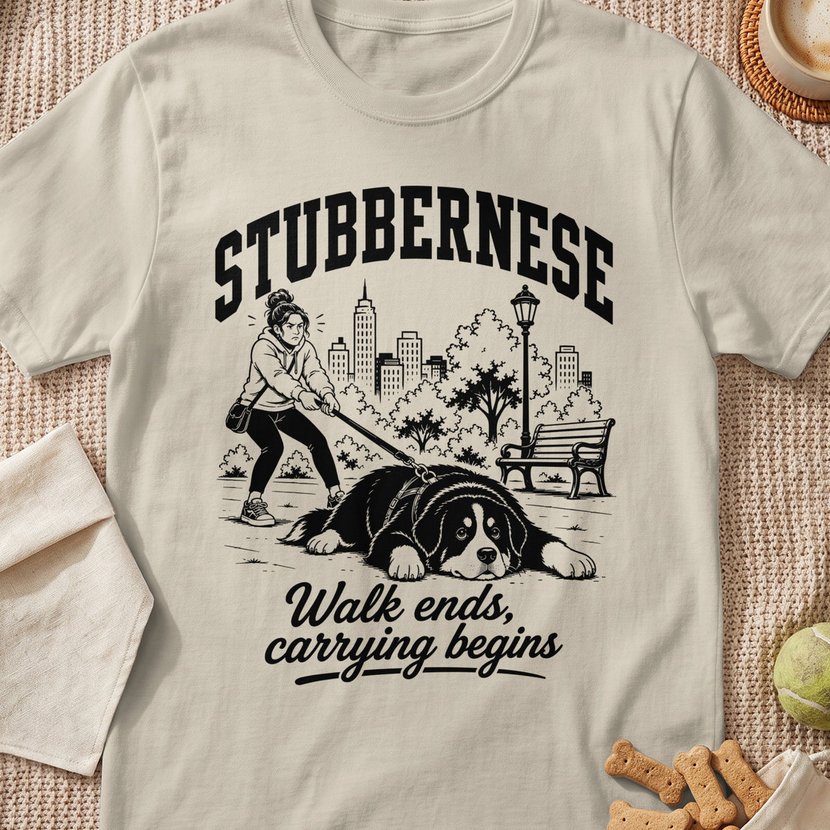 T-shirt graphic: Stubbernese dog and person in park, with text "Walk ends, carrying begins."