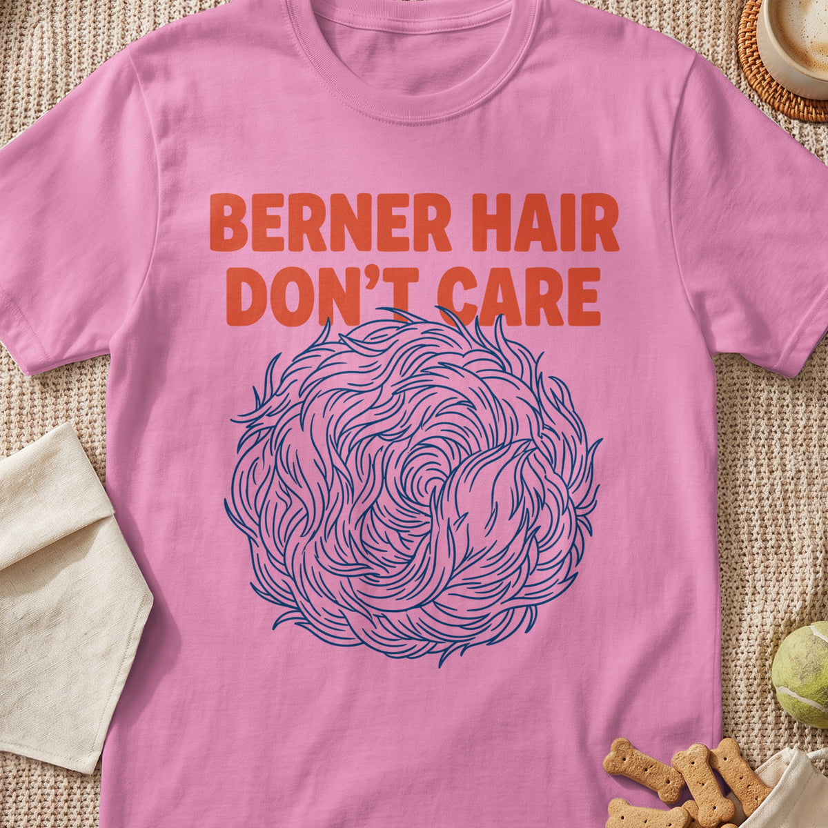 Pink t-shirt with orange text "BERNER HAIR DON'T CARE" and a blue abstract swirl.
