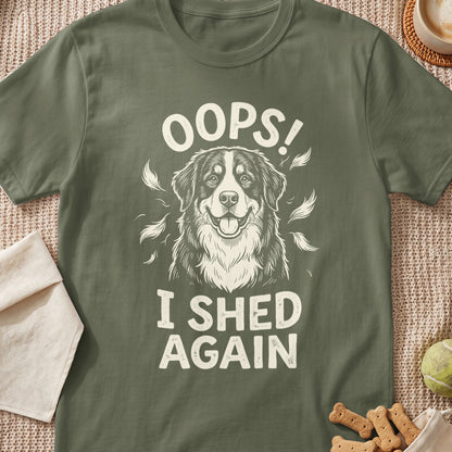 Green t-shirt with a dog graphic and text "OOPS! I SHED AGAIN".