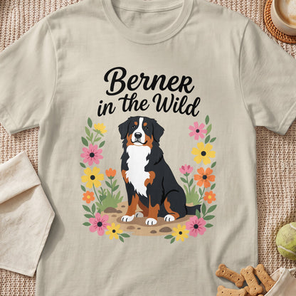 Bernese Mountain Dog with text "Berner in the Wild" surrounded by flowers.