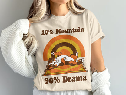 Cream t-shirt with brown text 10% Mountain and 90% Drama, and a dog graphic.