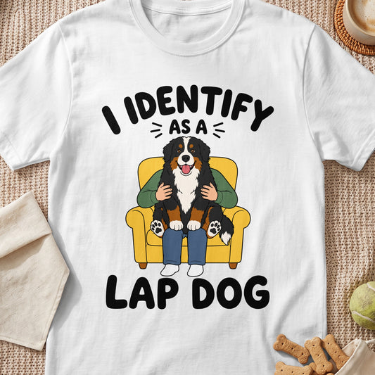 Bernese Mountain Dog sitting on lap with text "I identify as a lap dog".