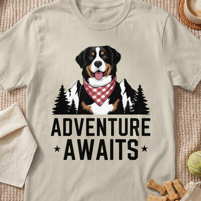 Bernese Mountain Dog with red bandana, mountains, trees, and text "ADVENTURE AWAITS".