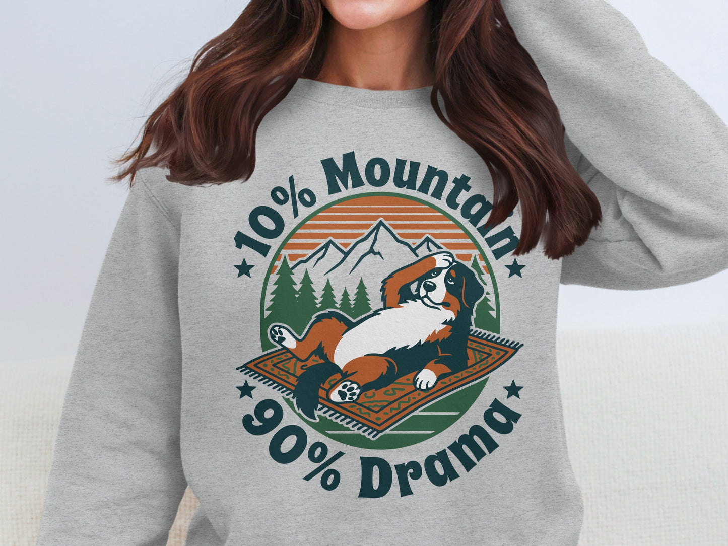 Bernese Mountain Dog relaxing on a rug with text "10% Mountain 90% Drama".