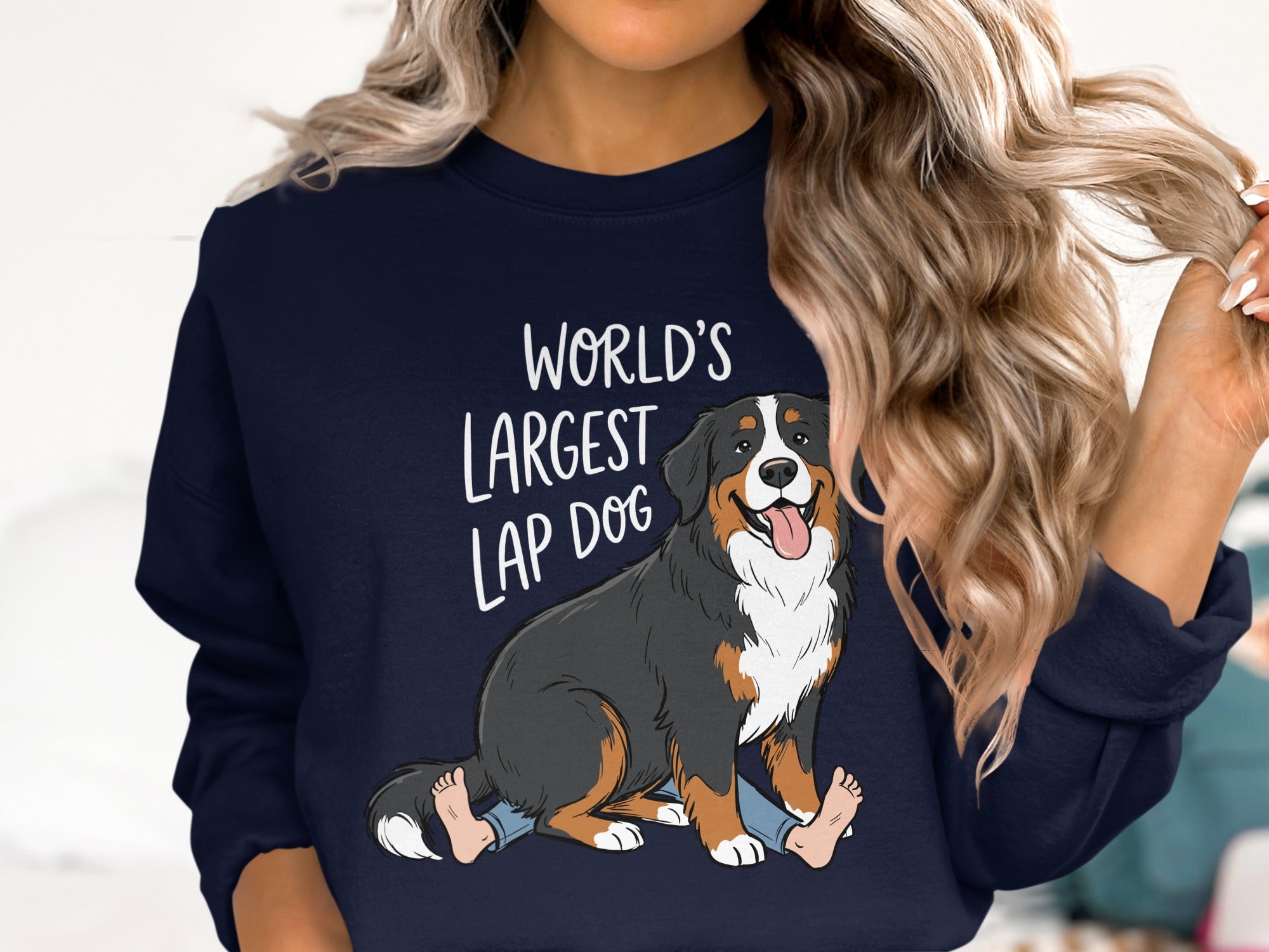Bernese Mountain Dog graphic with "World's Largest Lap Dog" text on navy sweatshirt.