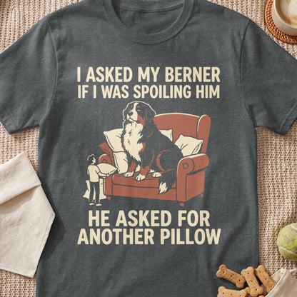 Bernese Mountain Dog on armchair, text reads "I asked my Berner if I was spoiling him, he asked for another pillow".