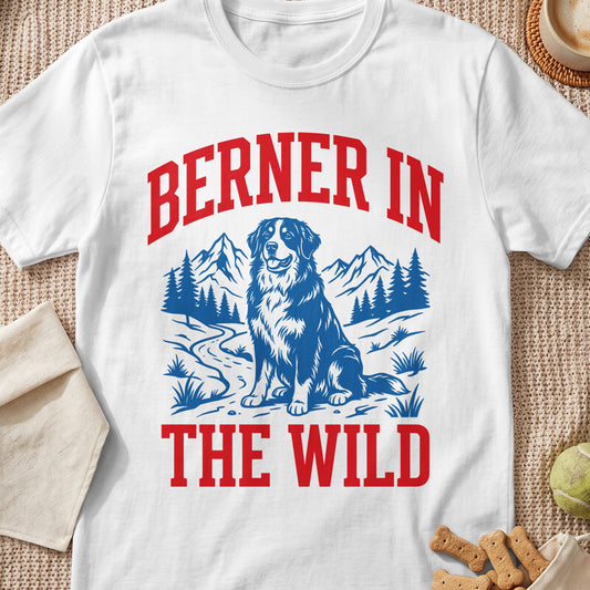 White t-shirt graphic with text "BERNER IN THE WILD" and a dog in a mountain landscape.