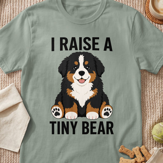T-shirt with "I RAISE A TINY BEAR" text and a Bernese Mountain Dog illustration.