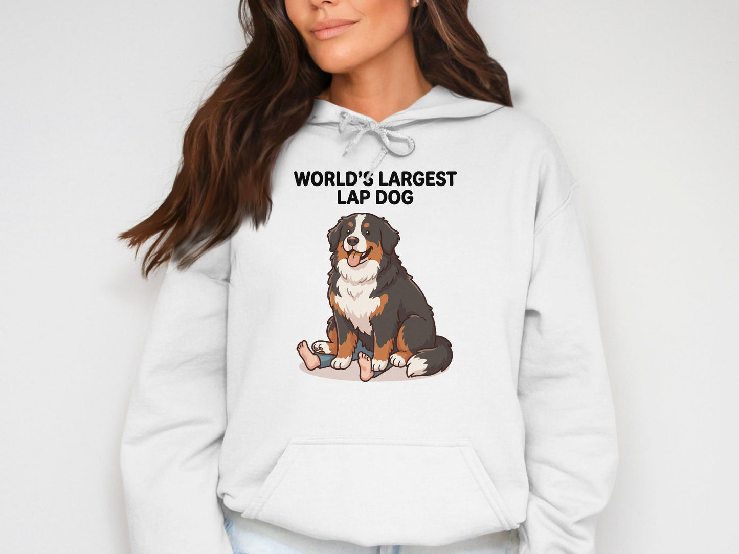 White hoodie with "WORLD'S LARGEST LAP DOG" and a Bernese Mountain Dog illustration.