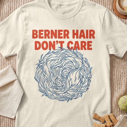Cream t-shirt with red text "BERNER HAIR DON'T CARE" and a circular blue hair design.