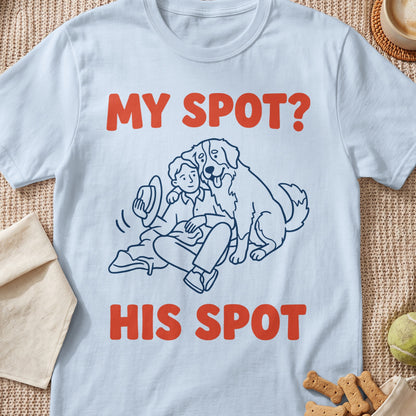 Light blue t-shirt with line drawing of person and dog, text reads "MY SPOT? HIS SPOT".