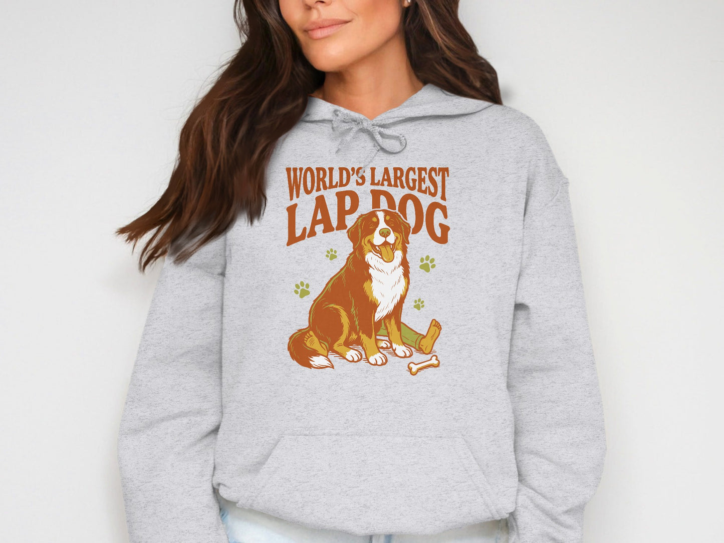 Grey hoodie with "World's Largest Lap Dog" text and Bernese Mountain Dog illustration.