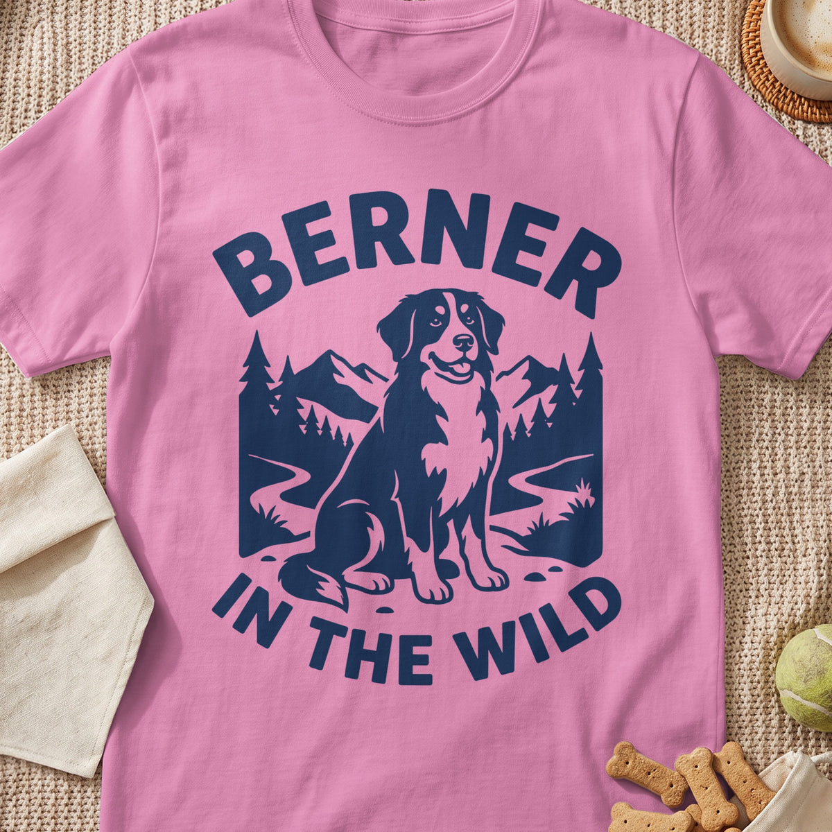Pink t-shirt with dark blue graphic of a Bernese Mountain Dog and text "BERNER IN THE WILD".