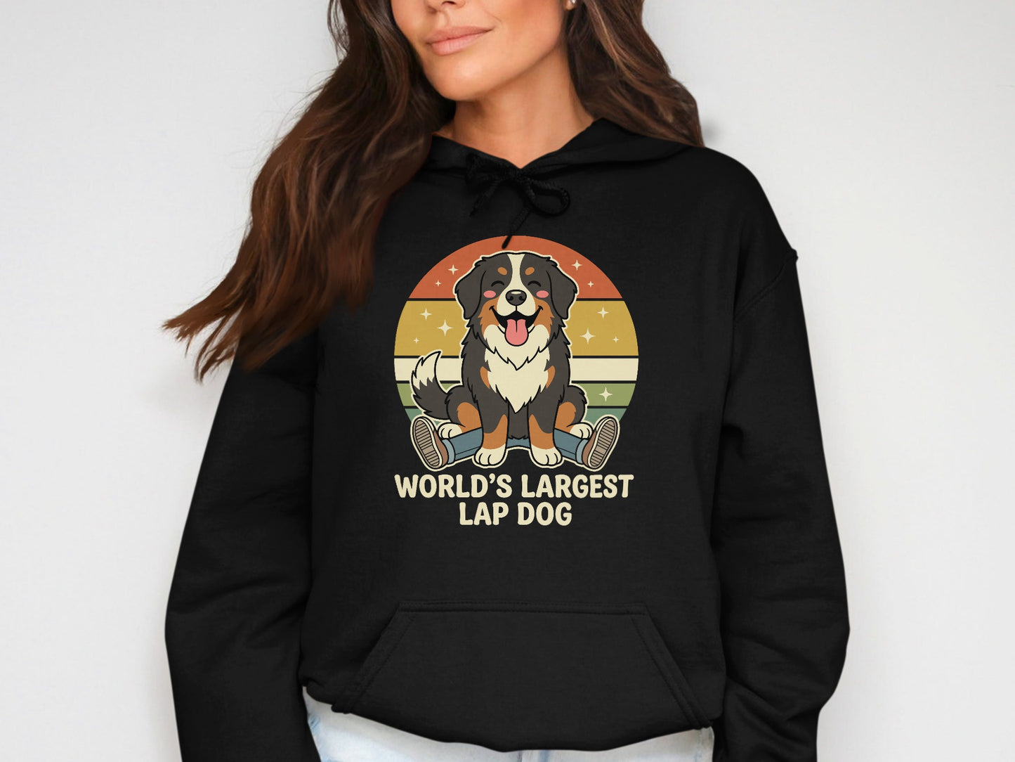 Black hoodie with cartoon Bernese Mountain Dog and text "World's Largest Lap Dog."