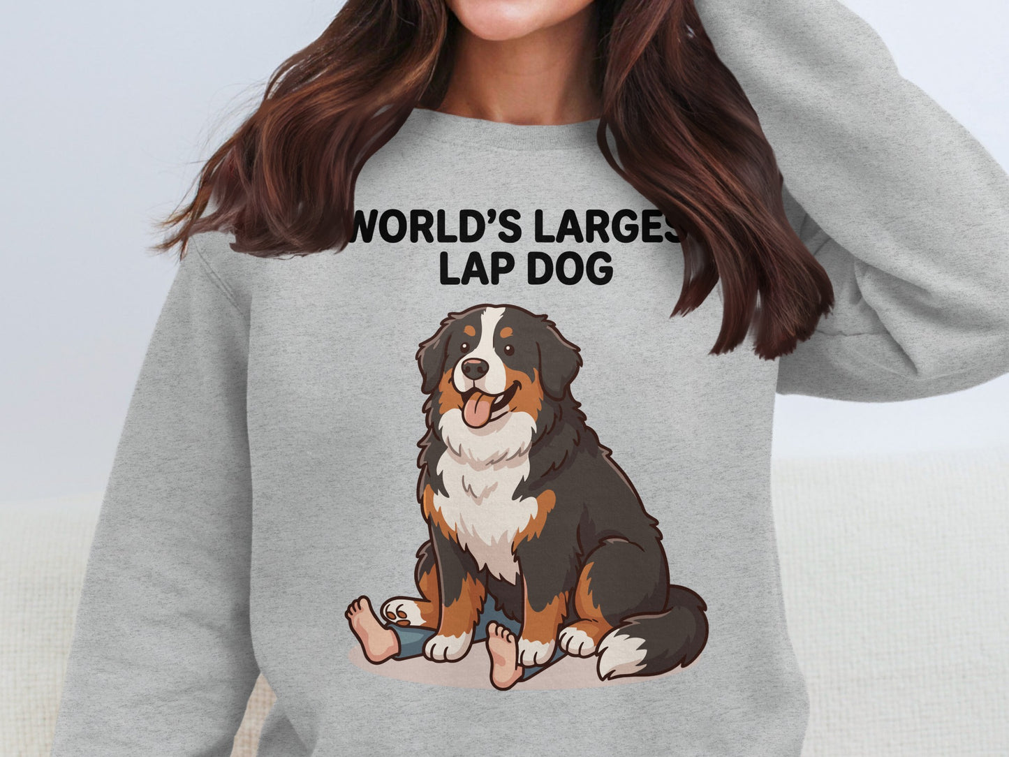 Gray sweatshirt with "WORLD'S LARGEST LAP DOG" text and cartoon Bernese Mountain Dog.