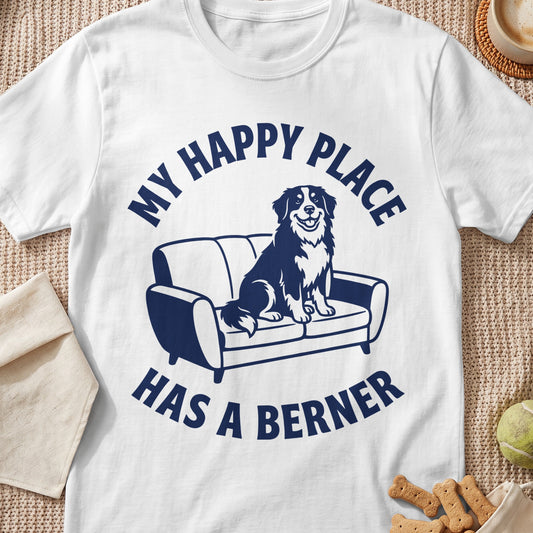 White t-shirt with navy blue graphic of a dog on a couch and text.