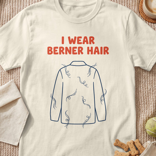 Cream shirt with red text "I WEAR BERNER HAIR" and a blue outline of a shirt covered in stray hairs.