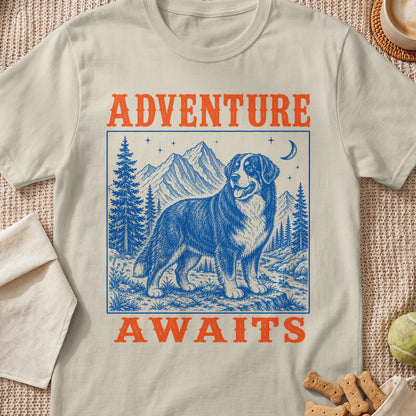 Bernese Mountain Dog in mountains with trees and moon, text "ADVENTURE AWAITS".