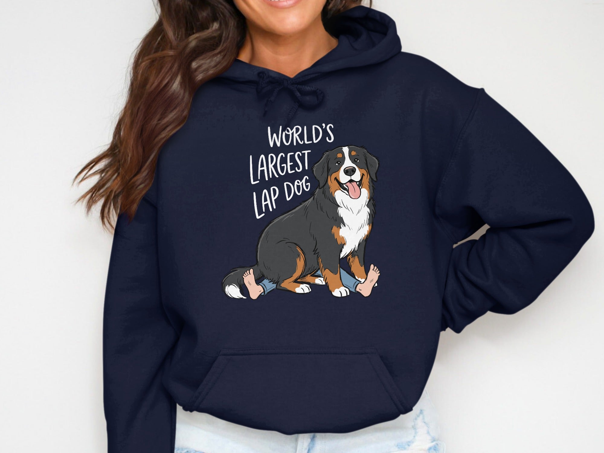 Navy hoodie with "World's Largest Lap Dog" text and cartoon Bernese Mountain Dog graphic.