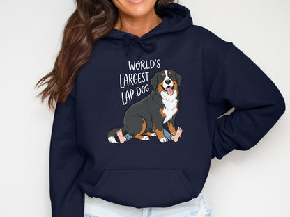 Navy hoodie with "World's Largest Lap Dog" text and cartoon Bernese Mountain Dog graphic.
