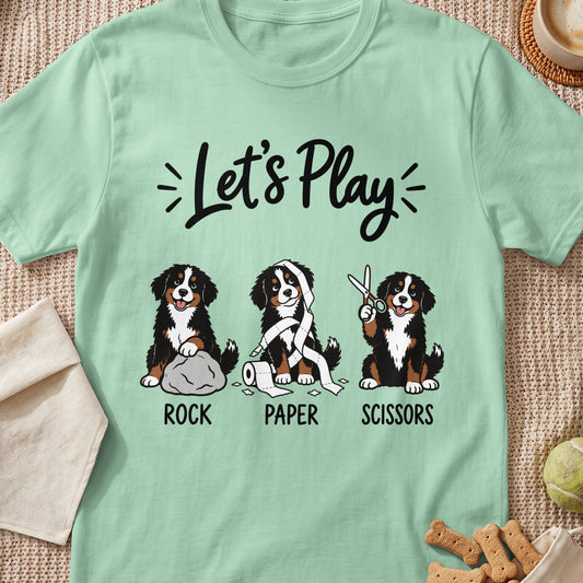 Three Bernese Mountain Dogs play rock, paper, scissors with "Let's Play" text.