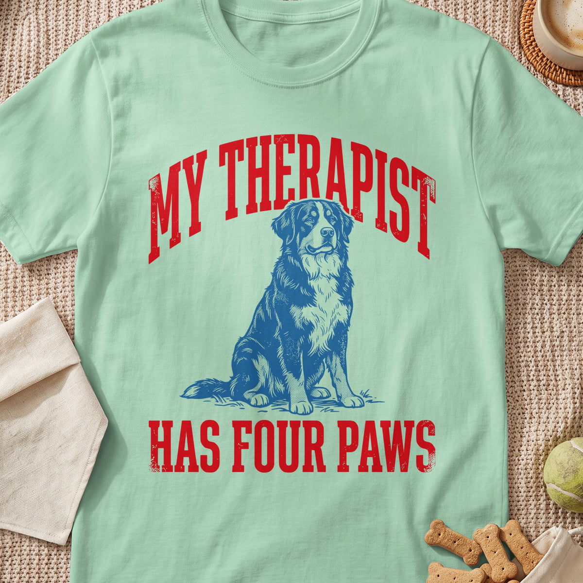 Light green t-shirt with blue dog and red text "MY THERAPIST HAS FOUR PAWS".