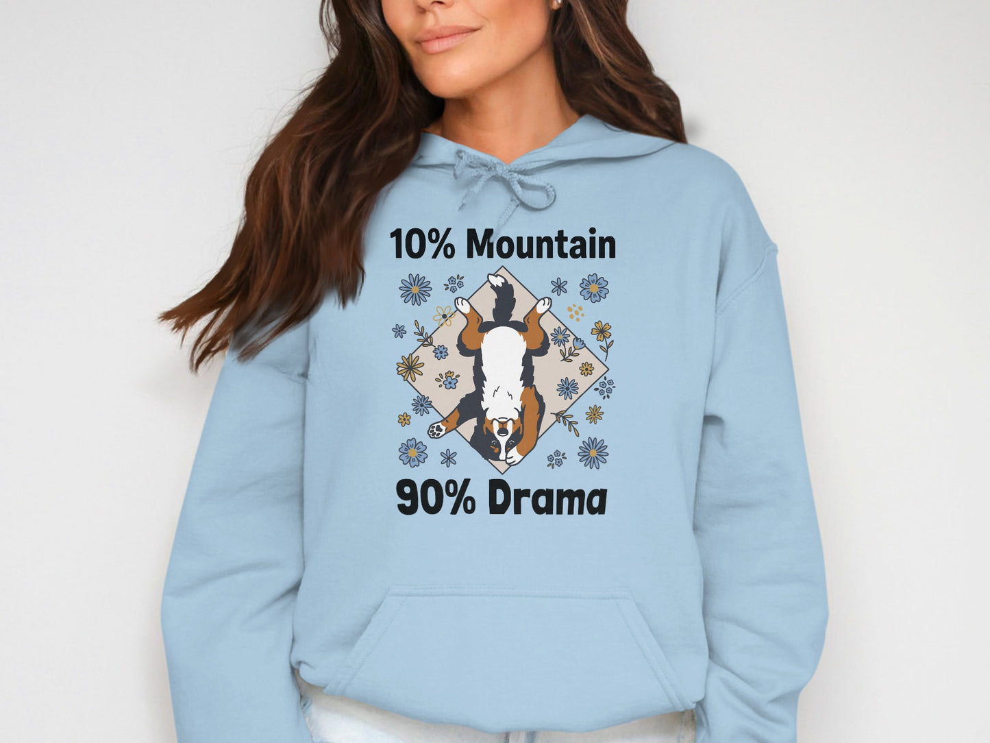 Light blue hoodie with a Bernese Mountain Dog graphic and text "10% Mountain 90% Drama".