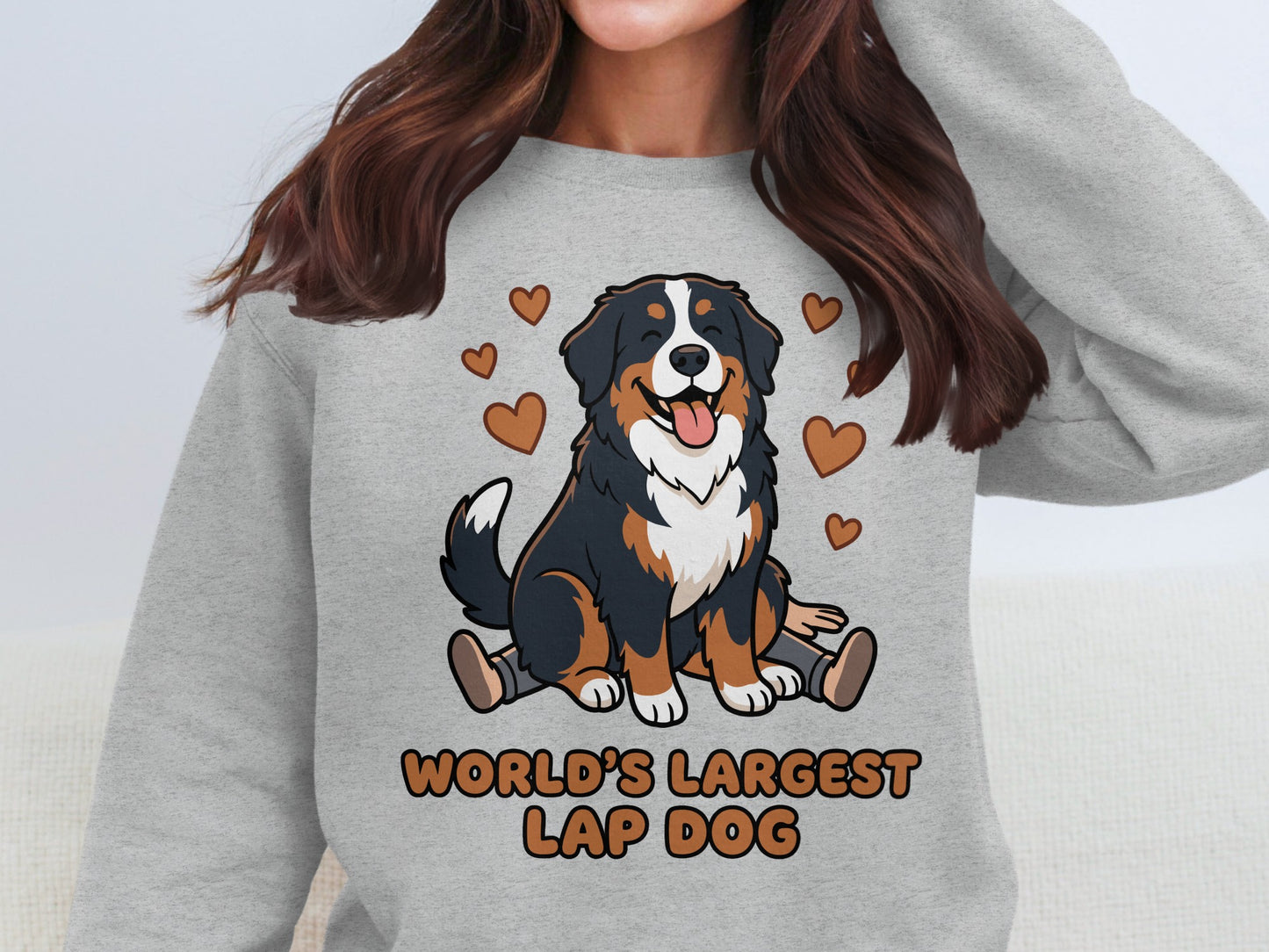 Bernese Mountain Dog graphic with "World's Largest Lap Dog" text on grey sweatshirt.