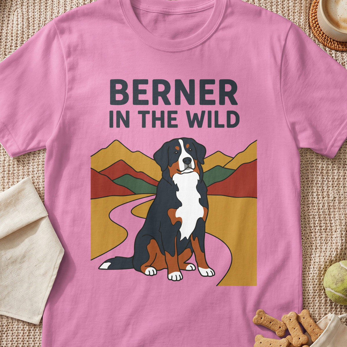Pink t-shirt with "BERNER IN THE WILD" text and a Bernese Mountain Dog illustration.