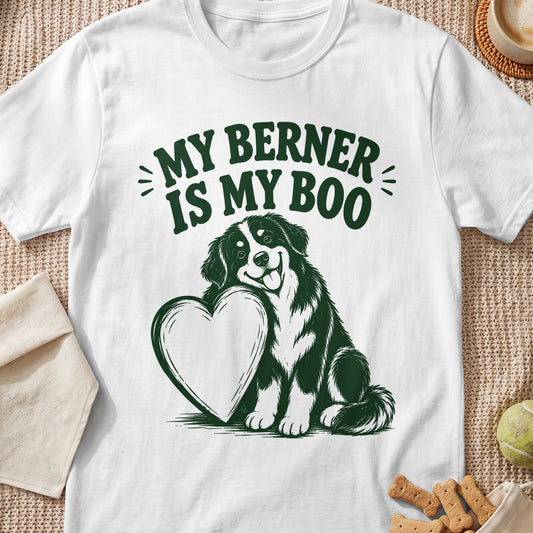 White t-shirt with green graphic of a Bernese Mountain Dog hugging a heart, text says "MY BERNER IS MY BOO".
