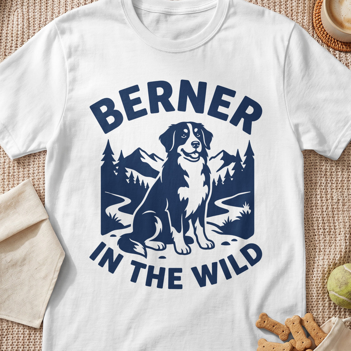White t-shirt with dark blue graphic of a Berner dog and text "BERNER IN THE WILD".