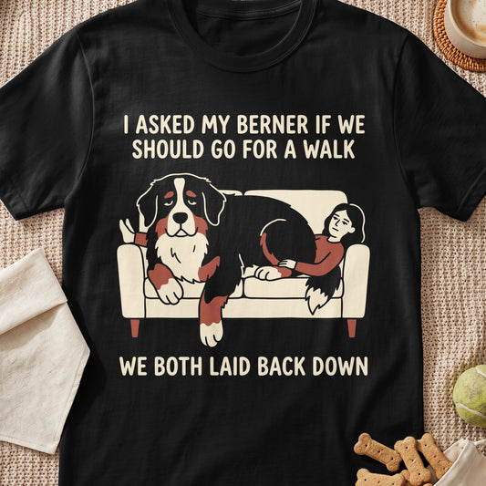 Black t-shirt with text and illustration of a Bernese Mountain Dog and person on a couch.